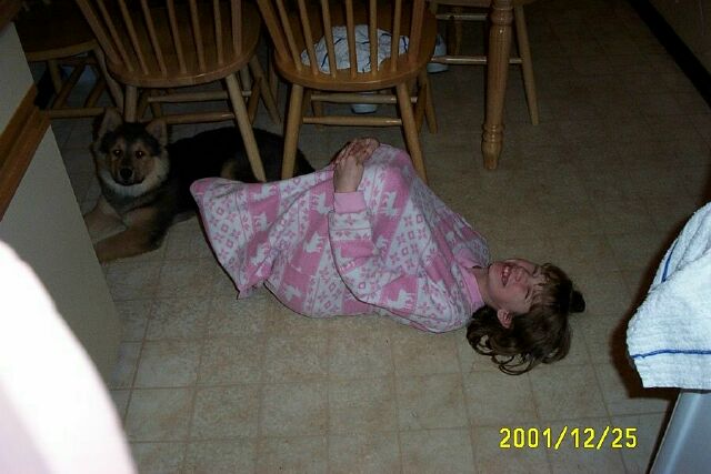 Emily and King dry-mop the kitchen