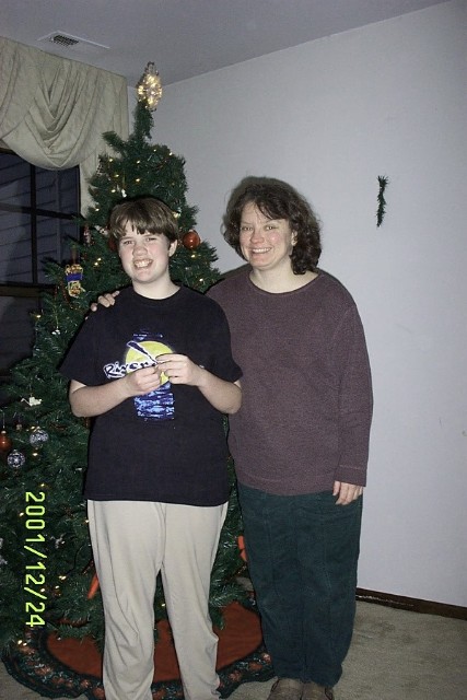 Mom and Catherine in front of the Christmas tree